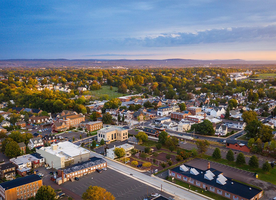 Souderton, PA - Aerial View of Buildings and Homes in Downtown Souderton Pennsylvania During the Early Fall at Sunset