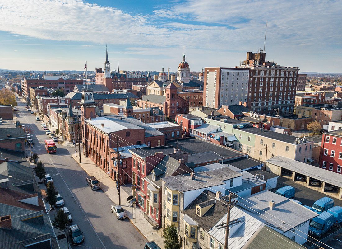 York, PA - Aerial View of Main Street Homes and Buildings in Downtown York Pennsylvania with a Cloudy Blue Sky